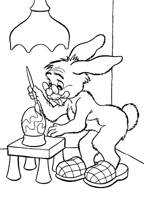 Kolorowanka Wielkanocna bardzo stary królik w okularach maluje pisankę w domu pod lampą stojąc w kapciach