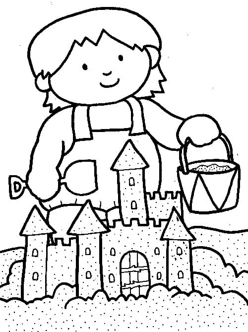 Dziewczynka buduje zamek z piasku